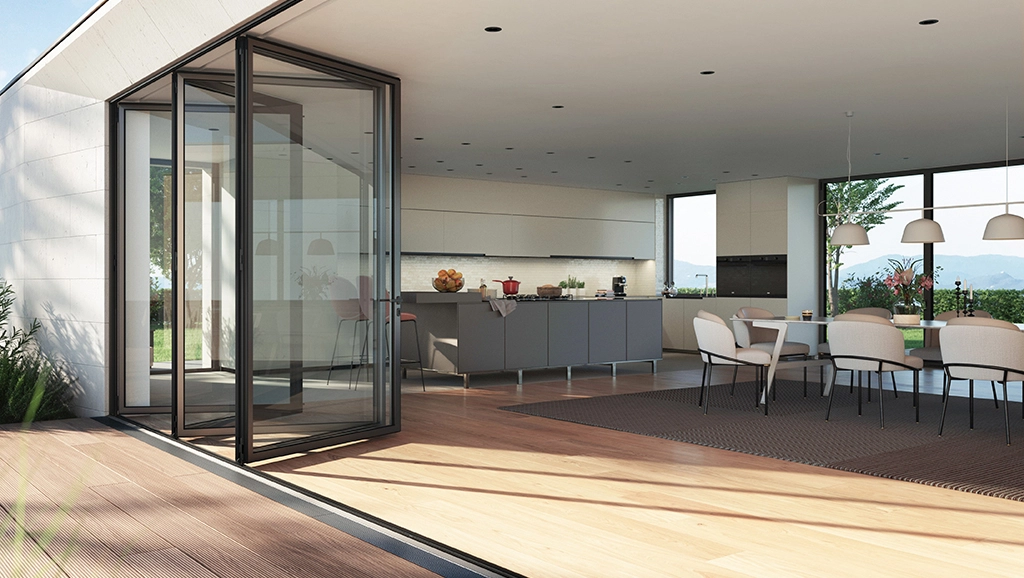 Lichtdurchflutete, moderne Küche mit Esszimmer und einer geöffneten Schüco FD 90 Faltanlage als Glasschiebetür