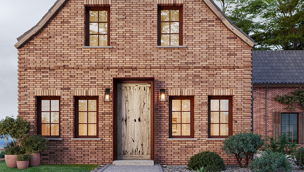 Ein Backsteinhaus mit einer FENNEN Design-Haustür Solen.